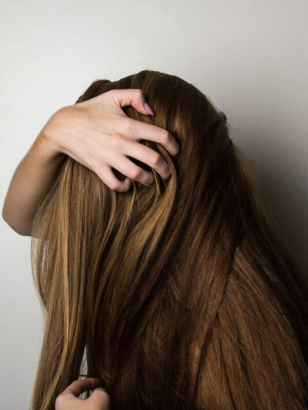 Zbogom sijeda koso, photo of woman covering face with her hair