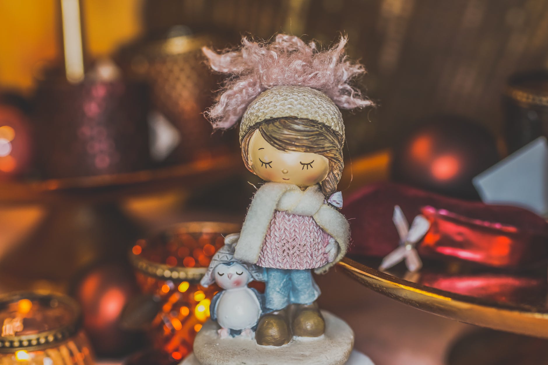 girl and penguin figurine