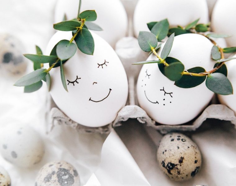 cute painted eggs with crown of leaves
