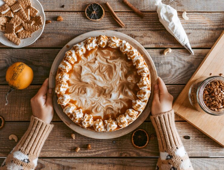 crop unrecognizable woman serving delicious pie on table