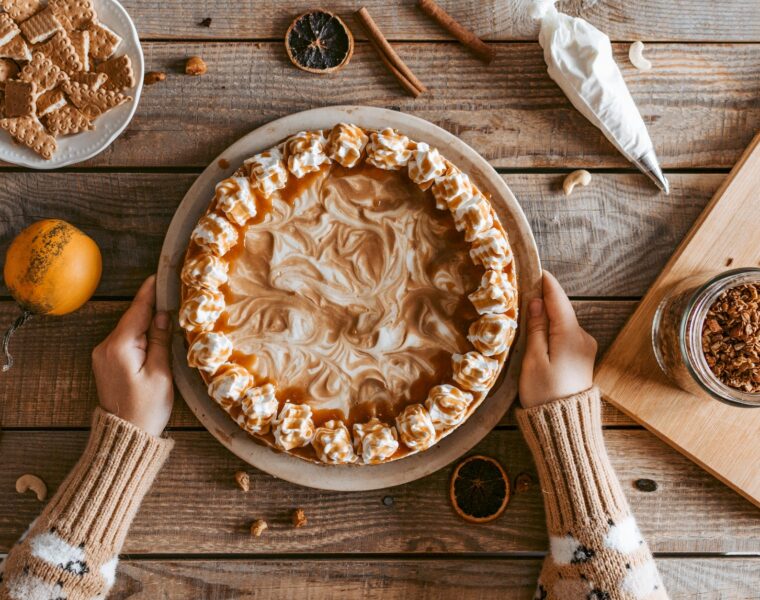crop unrecognizable woman serving delicious pie on table