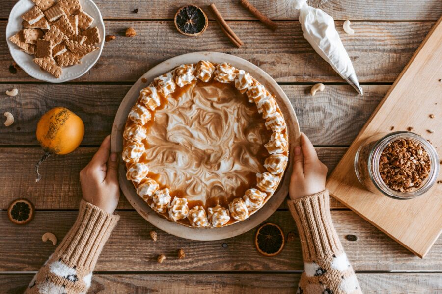 crop unrecognizable woman serving delicious pie on table