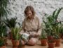 Patnja, woman sitting while reading book near potted plants