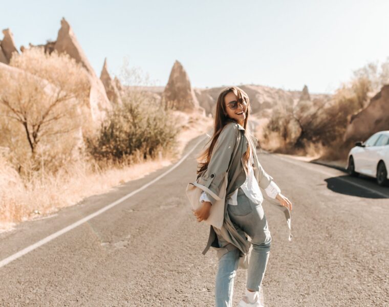 unutarnji glas, woman in beige trench coat walking on asphalt road