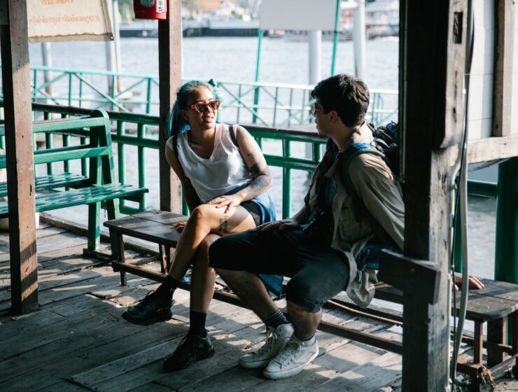 Poze, man and woman sitting on wooden bench
