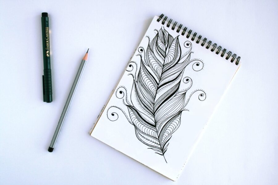 črčkarije i škrabotine, spring book with feather sketch