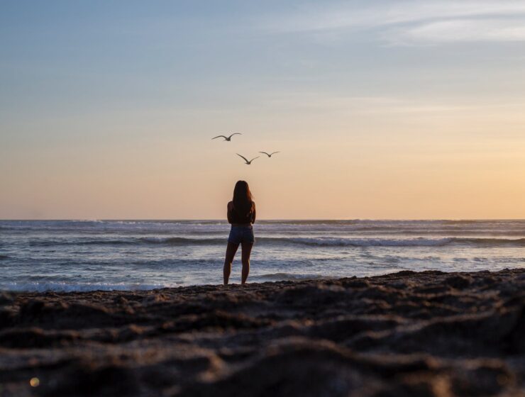 Show must go on, woman gazing at the ocean view