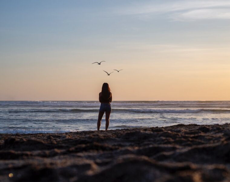 Show must go on, woman gazing at the ocean view