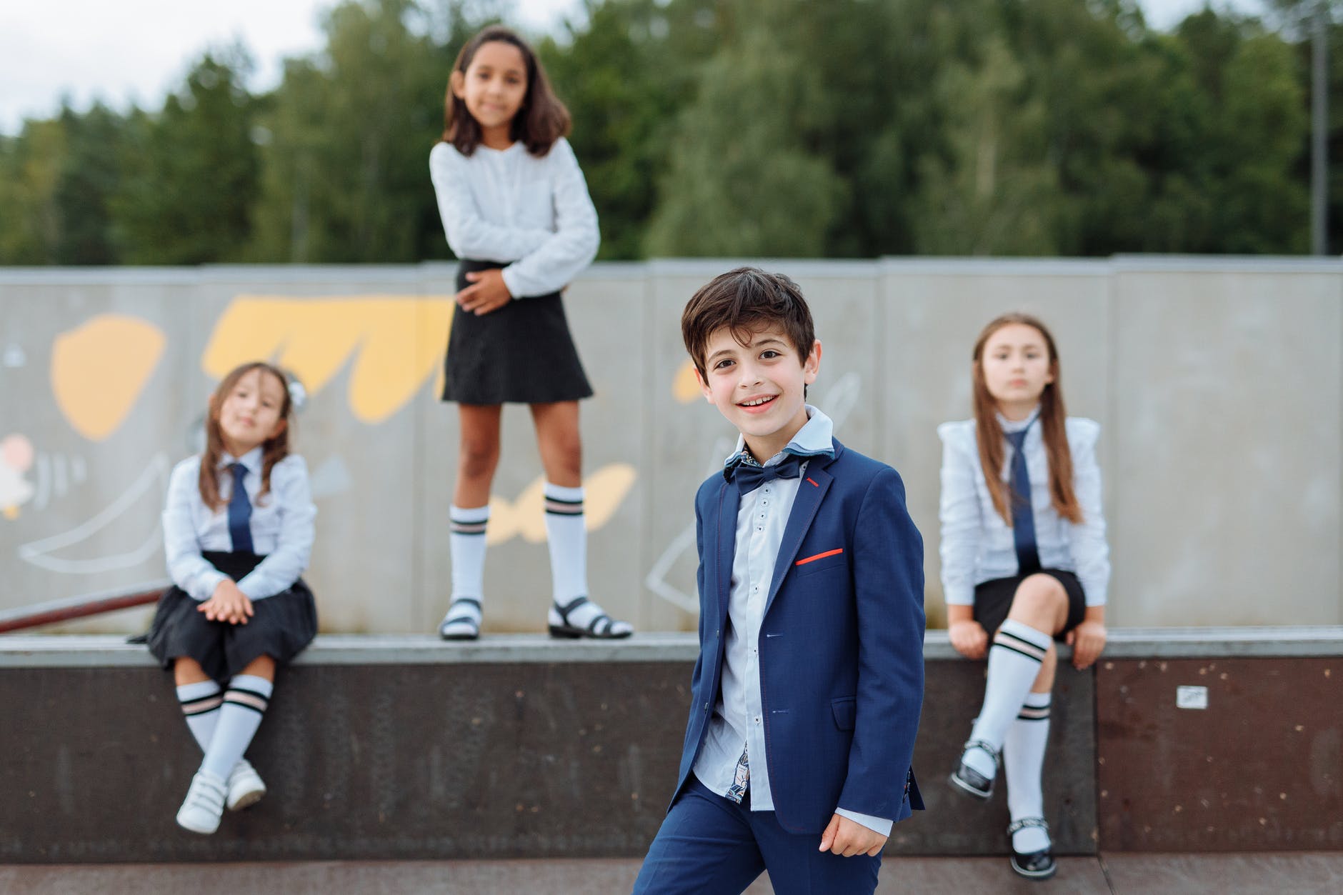 happy students wearing their school uniforms
